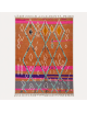 Tapis Beni Ouarain artisanal marocain en laine terracotta et rose fuchsia à motifs géométriques