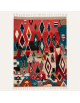 Tapis Beni Ouarain artisanal marocain en laine rouge corail et motifs géométriques multicolores