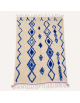 Tapis Beni Ouarain artisanal marocain écru ivoire et bleu cobalt à motifs géométriques berbères