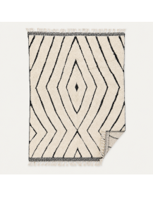 Revers du tapis non visible sur la photographie