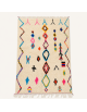 Tapis Beni Ouarain artisanal marocain en laine ivoire crème avec motifs géométriques multicolores