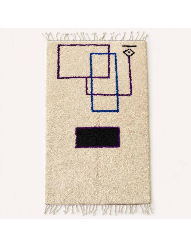 Tapis Beni Ouarain artisanal marocain en laine ivoire crème à motif géométrique noir violet et bleu