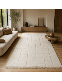 Tapis Beni Ouarain ivoire dans un intérieur contemporain aux matières naturelles