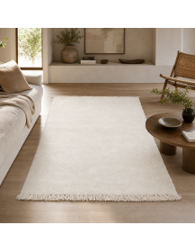 Tapis Beni Ouarain ivoire dans un intérieur contemporain aux matières naturelles