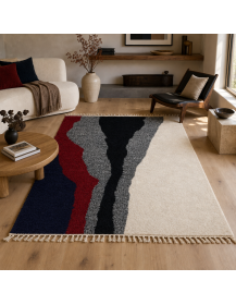 Tapis artisanal marocain Beni Ouarain ivoire et noir dans un intérieur contemporain chaleureux