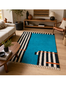 Tapis Beni Ouarain turquoise et noir intégré dans un salon contemporain bohème