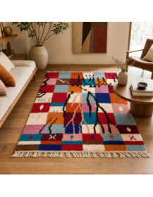 Tapis Beni Ouarain patchwork rouge et orange dans un intérieur contemporain chaleureux