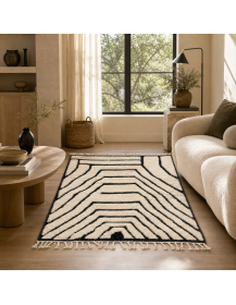 Tapis Beni Ouarain ivoire crème et noir dans un intérieur contemporain aux matières naturelles