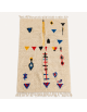 Tapis Beni Ouarain artisanal marocain en laine écru ivoire à motifs géométriques multicolores