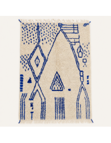 Tapis Beni Ouarain artisanal marocain en laine écrue avec motifs géométriques bleu cobalt