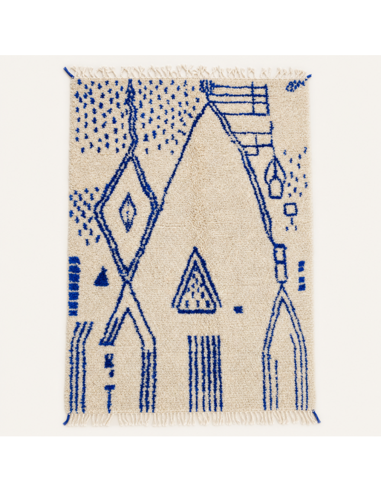 Tapis Beni Ouarain artisanal marocain en laine écrue avec motifs géométriques bleu cobalt