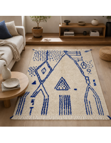 Tapis artisanal marocain Beni Ouarain écru et bleu cobalt dans un salon contemporain chaleureux
