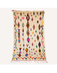 Tapis Beni Ouarain artisanal marocain en laine ivoire crème et motifs géométriques multicolores