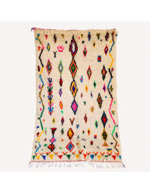 Tapis Beni Ouarain artisanal marocain en laine ivoire crème et motifs géométriques multicolores